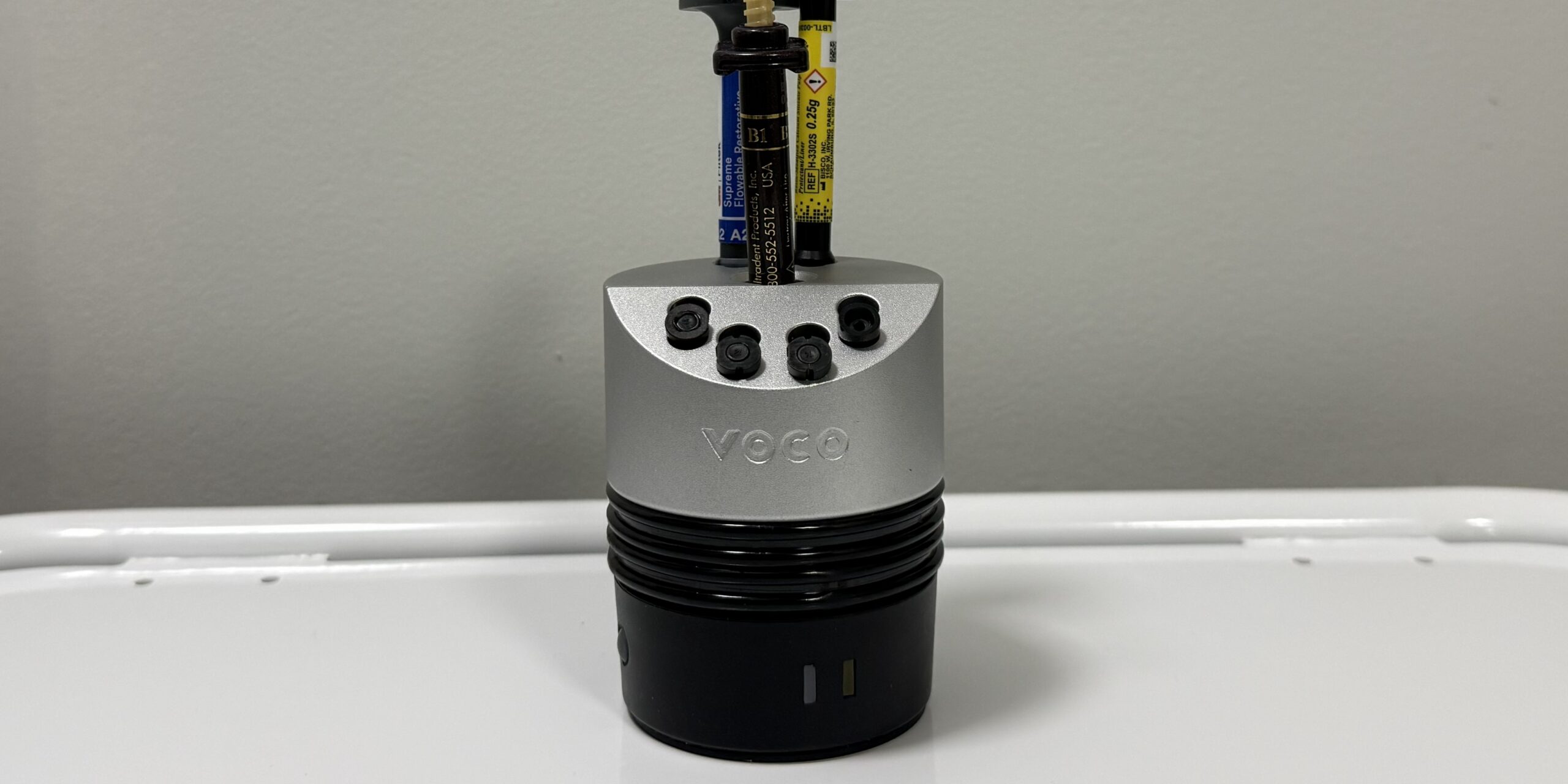 Composite warmer device at Richmond Dental Spa used to pre-heat resin composite before restoration placement
