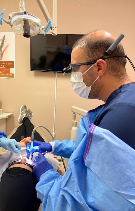 Dr. Firas Albadran working in the operatory with magnification at Richmond Dental Spa