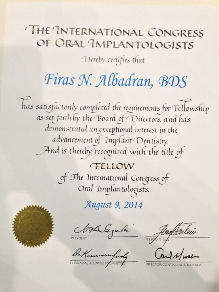 Dr. Firas Albadran's Fellowship certificate from the International Congress of Oral Implantologists (ICOI), awarded August 9, 2014.