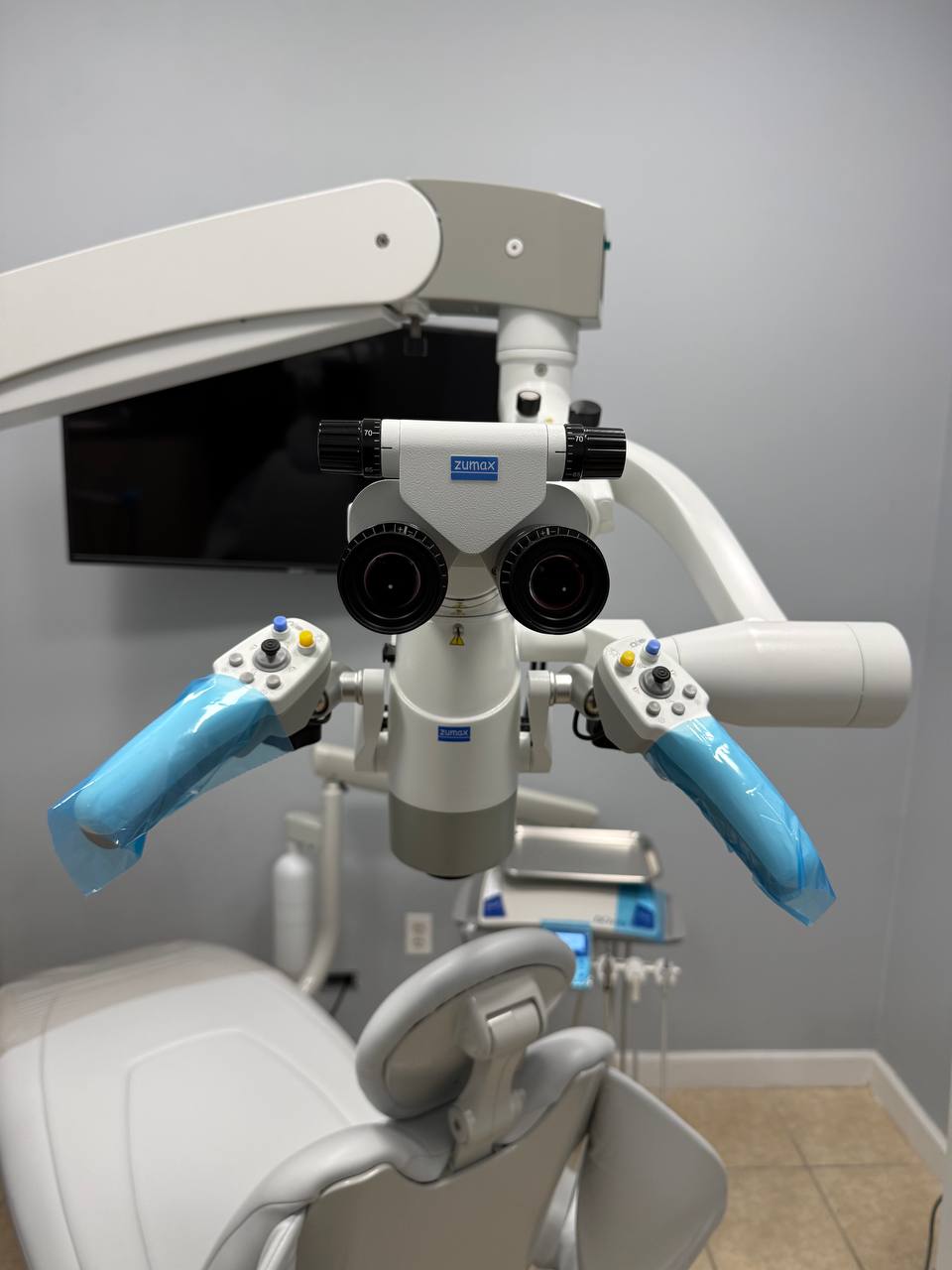 Zumax dental surgical microscope used by Dr. Firas Albadran at Richmond Dental Spa