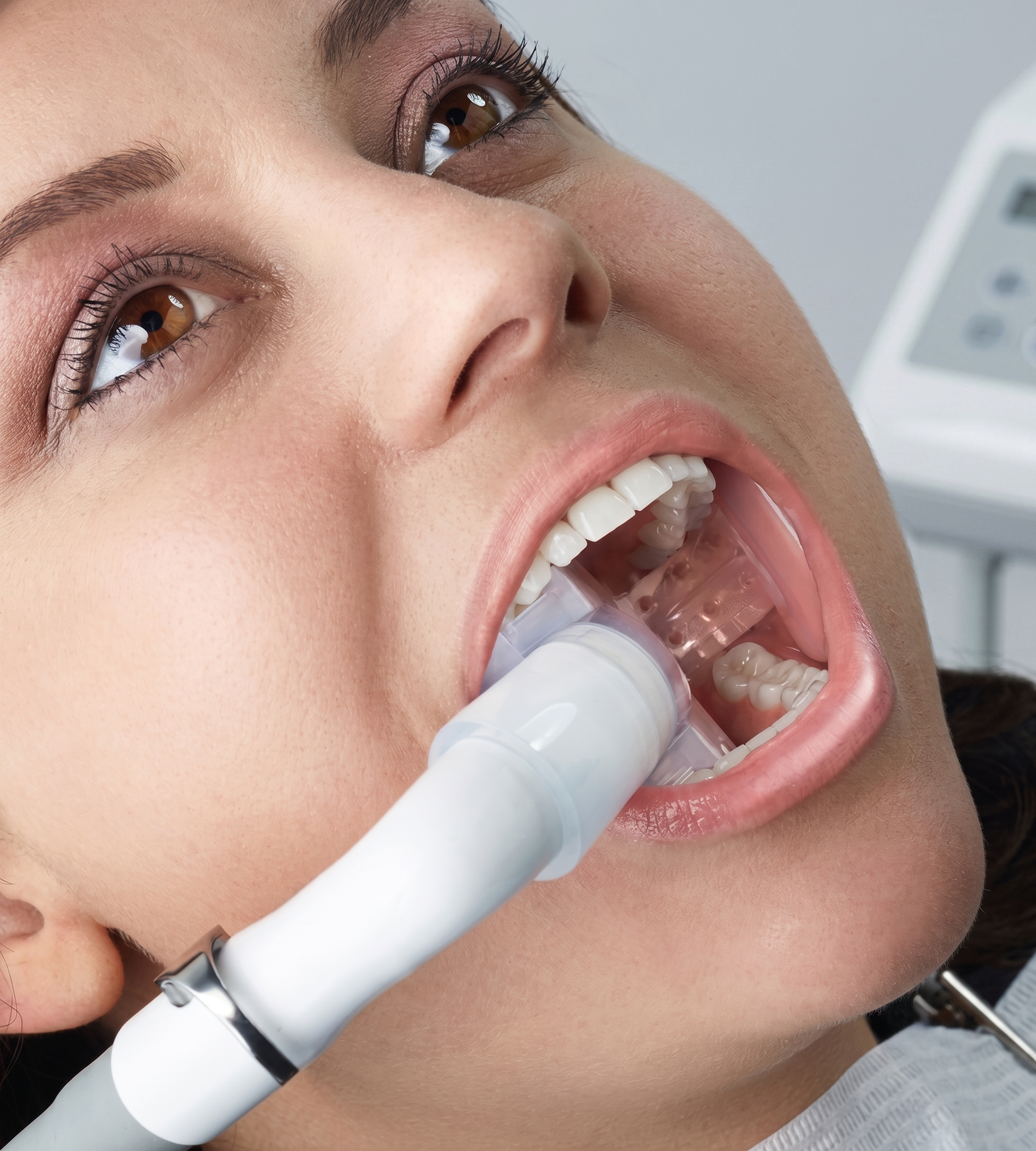 Patient with DryShield isolation system in place during dental treatment